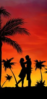 Silhouette of couple under palm trees at sunset beach.