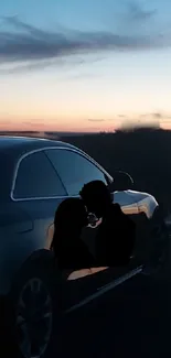 Silhouette couple by a car at sunset on a tranquil road.