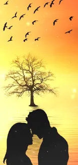 Silhouette of a couple kissing at sunset with a tree and birds.