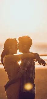 Couple embracing at sunset on a beach.