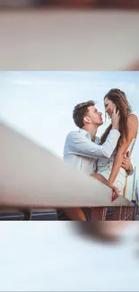 Romantic couple embracing on a pier with a sunset backdrop.