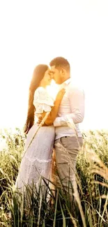 Romantic couple embracing in sunlit field.