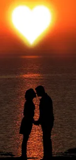 Romantic sunset wallpaper with a couple's silhouette and a heart shaped sun.