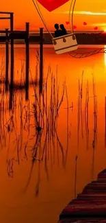 Romantic sunset over a serene lake with hot air balloon silhouette.