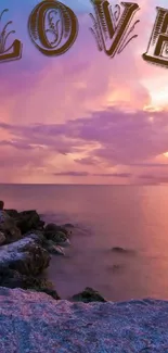 Beautiful sunset with 'LOVE' text over a rocky shoreline.