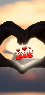 Silhouette of heart-shaped hands with love text during sunset.