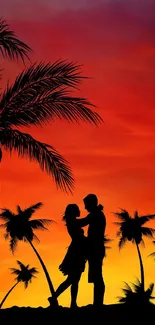 Silhouette of a couple under palm trees with a vibrant sunset sky.