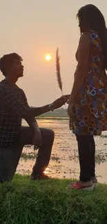 Romantic proposal by a lake during sunset.