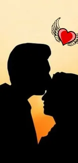 Silhouette of a couple at sunset with a heart and wings.