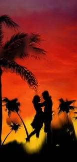 Romantic couple silhouette at sunset with palm trees.