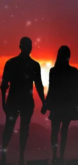 Silhouetted couple holding hands at sunset, vivid red and orange sky backdrop.