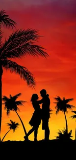 Silhouetted couple under palm trees against a vibrant sunset sky.