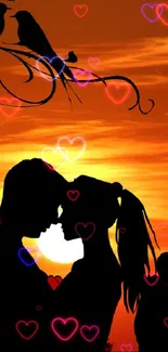 Silhouette of couple embracing at sunset with birds above.