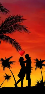 Silhouette of a couple in front of a sunset with palm trees.