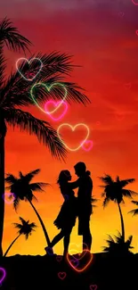 Silhouette of couple with palm trees against a vibrant orange sunset.