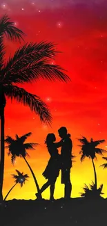 Silhouette of a couple under palms at sunset.