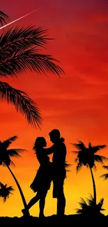 Silhouette of couple under palm trees at sunset with vibrant red and orange sky.