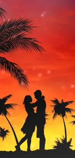 Silhouette of couple under palm trees at sunset.