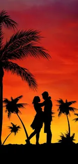 Romantic silhouette of a couple under palm trees with an orange sunset backdrop.