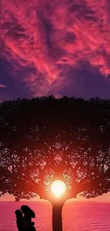 Silhouette couple under tree at sunset with pink clouds and purple sky.