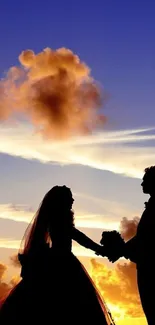 Silhouette of couple in sunset wedding scene.