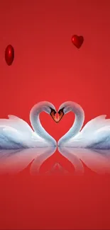 Romantic red wallpaper with two swans forming a heart shape.