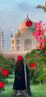 Woman in garden near Taj Mahal, surrounded by red roses.