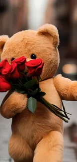 Teddy bear holding red roses on a street.