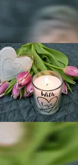 Mobile wallpaper with tulips, candle, and heart decor.