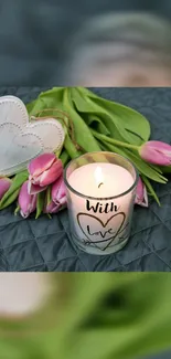 Romantic candle with pink tulips and hearts.