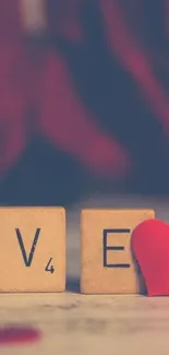 LOVE spelled with Scrabble tiles and red heart.