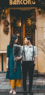 A couple in love on a charming city street with warm tones and a vintage vibe.