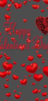 Valentine's wallpaper with red hearts on gray background.