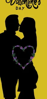 Couple silhouette with heart on yellow Valentine's background.