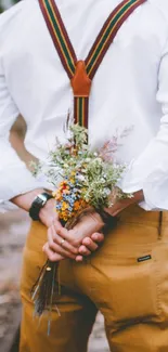 Romantic couple on railway track holding bouquet.