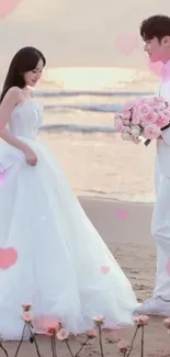 Romantic beach wedding scene with couple at sunset.