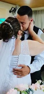 Bride and groom share a romantic wedding kiss.