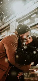 Romantic couple embracing under falling snow in a cozy winter scene.