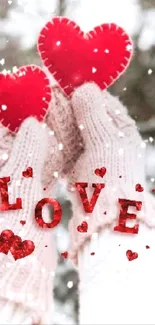 Hands in gloves holding red hearts in snowflakes.