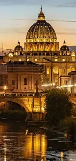 Majestic Rome cathedral glowing at sunset with river reflection.