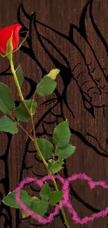 Red rose with dragon and pink hearts on wood background.