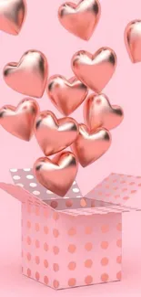 Rose gold hearts emerging from polka dot box against pink background.