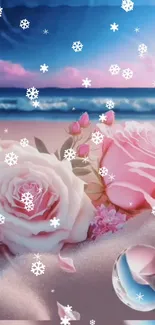 Pink and white roses on a snowy beach with ocean backdrop.