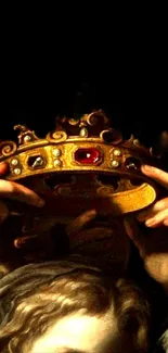 Hands holding a golden crown in dim light.