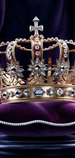 Golden crown with jewels on purple velvet.