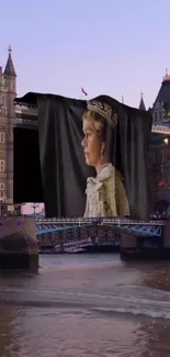 Royal portrait displayed on London's Tower Bridge at sunset.