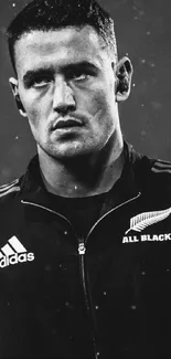 Black and white image of a focused rugby player.