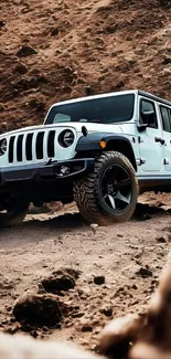 Off-road Jeep on rugged terrain in a scenic landscape.