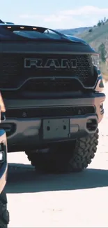 Off-road truck on a rugged terrain with a nature backdrop.