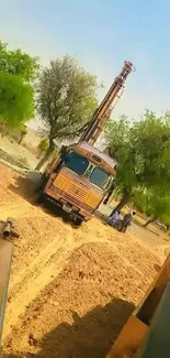 Rural scene with a construction drill and trees.